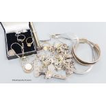 A group of assorted silver jewellery including a charm bracelet and a telescopic pencil