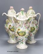 A set of three Coalbrookdale style vases and covers, height 42cm