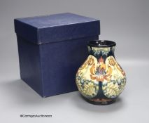 A boxed limited edition Moorcroft pottery vase in the Festive Flame pattern, designed by Kerry