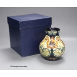 A boxed limited edition Moorcroft pottery vase in the Festive Flame pattern, designed by Kerry