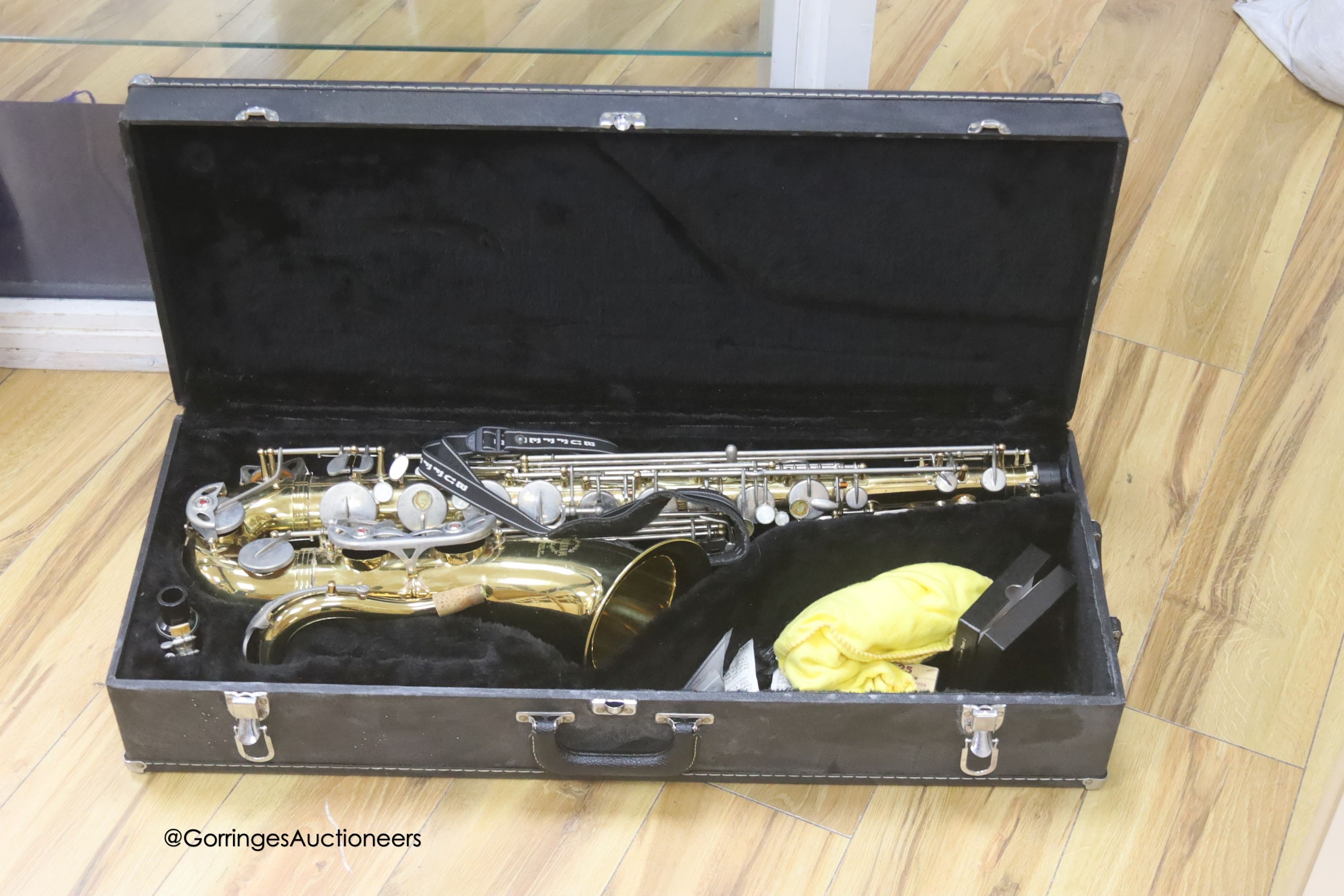 A cased Earlham brass saxophone and music sheets - Image 4 of 7