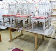 A weathered rectangular teak extending garden table, 220cm extended, width 110cm, height 74cm and