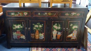 A Chinese black and polychrome painted dresser, fitted three drawers over cupboards, length 156cm,