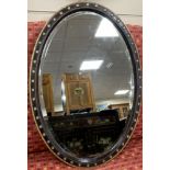 A 19th century oval Irish wall mirror with painted simulated grain, width 59cm, height 83cm