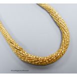 A yellow gold (9kt), flexible close link necklace of tapering form, gross 50g, 43cm.