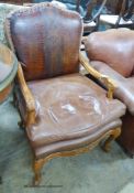 An 18th century style tan leather elbow chair, width 70cm, depth 64cm, height 105cm