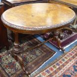 A Victorian oval tulip banded burr walnut centre table, width 104cm, depth 66cm, height 70cm