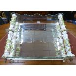 A German porcelain and glass three tier wall bracket, width 65cm, depth 18cm, height 58cm