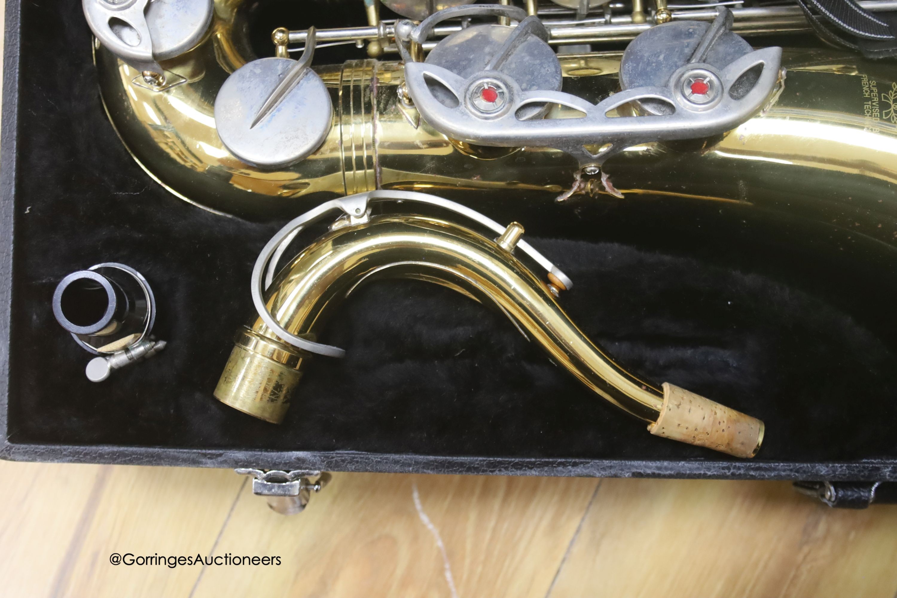 A cased Earlham brass saxophone and music sheets - Image 5 of 7