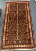 A Bakhtiari red ground rug, 210 x 110cm210 x 110cm