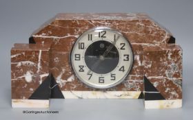 An Art Deco rouge marble clock garniture, length 36cm