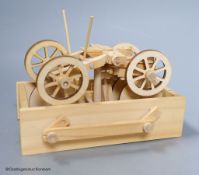 A modern lightwood mechanical model of a veteran motor car, height 16cm