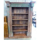 An Indian carved painted hardwood open bookcase, length 146cm, depth 55cm, height 220cm