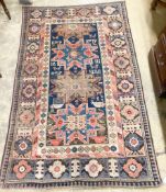 A Caucasian blue ground rug, 155 x 100cm