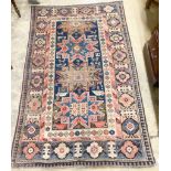 A Caucasian blue ground rug, 155 x 100cm