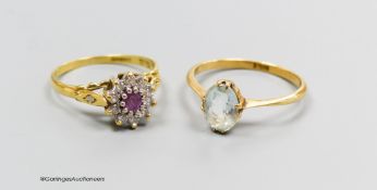 An 18ct gold diamond and pink stone cluster ring, size K and an 18ct gold and aquamarine ring, size