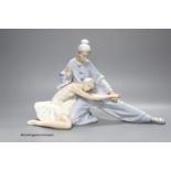 A large Lladro porcelain figure group 'Closing Scene', 24cm