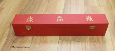 An OBE red block box, 55.5 x 9cm, empty