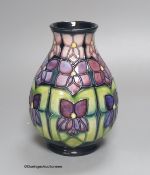 A Moorcroft Violets pattern vase, height 19cm