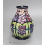 A Moorcroft Violets pattern vase, height 19cm