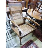 An early 20th century Colonial caned hardwood plantation chair