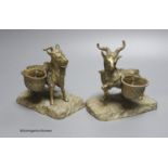 A pair of cast bronze goat salts, tallest 13cm