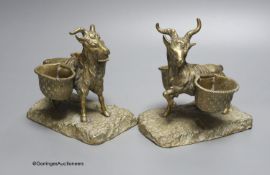 A pair of cast bronze goat salts, tallest 13cm