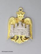 A 14ct, plat and diamond chip set 'eagle and castle' pendant, 27mm, gross weight 7.2 grams.