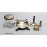 Small silver - a topped hair tidy, an ashtray, London 1900, 3.3oz., a napkin ring, a white metal
