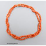 A 19th century coral bead long necklace, with Georgian yellow metal clasp, 92cm.
