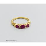 A 18ct gold ruby and diamond ring, size M, gross 5g.