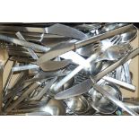 A suite of Georg Jensen stainless steel cutlery and condiments