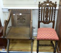 A Victorian carved oak "Glastonbury" chair and a carolean style oak carved dining chair (2)