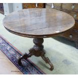 A Continental circular oak tea table, diameter 93cm, height 76cm