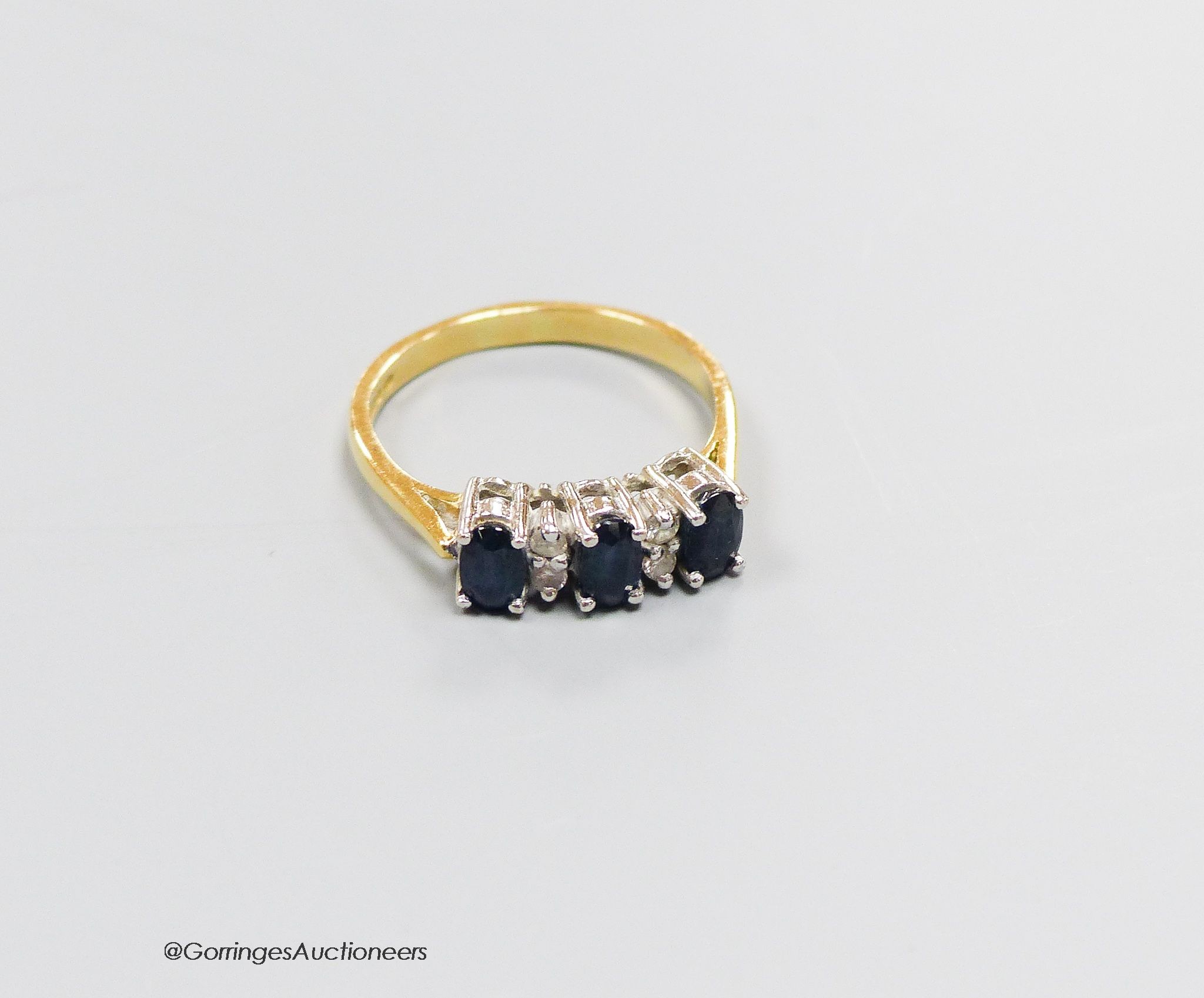 An 18ct gold sapphire and diamond dress ring, size N, gross 3.4g. - Image 2 of 3