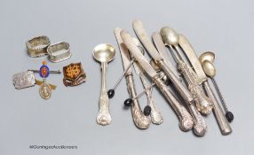 Six silver 'bean' handled coffee spoons, a Victorian silver mustard spoon, a butter knife, a pickle