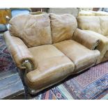 A contemporary small tanned leather two seater sofa, length 150cm, depth 90cm, height 86cm