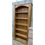 A reproduction tall pine open bookcase, length 94cm, depth 24cm, height 196cm