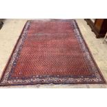 A Feraghan red ground carpet, 314 x 217cm