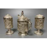 A three piece silver plated cruet set, by Elkington and co-, mustard pot and cover 11.5 cm high
