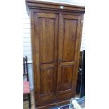 A hardwood two door cabinet, length 102cm, depth 68cm, height 201cm