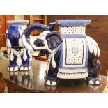 A pair of Chinese glazed earthenware elephant seats, width 60cm, height 43cm