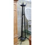 A late Victorian Godwin style black painted coat and stick stand, height 200cm