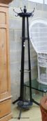 A late Victorian Godwin style black painted coat and stick stand, height 200cm