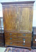 A George III mahogany linen press(lacking sliding trays), width 130cm, depth 60cm, height 202cm