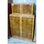 An Art Deco burr walnut veneered cocktail cabinet, length 94cm, depth 39cm, height 144cm