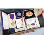 A cased OBE, a Knights silver gilt medal, miniatures, letters, etc.