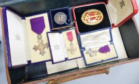 A cased OBE, a Knights silver gilt medal, miniatures, letters, etc.
