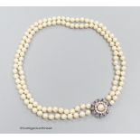 A two strand pearl necklace with sapphire and diamond set 14k white gold clasp