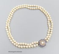 A two strand pearl necklace with sapphire and diamond set 14k white gold clasp
